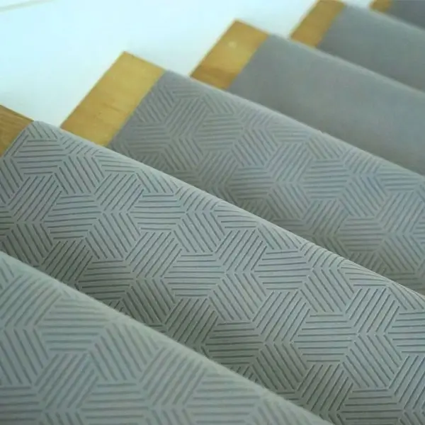 Gator Guard gray textured floor protection installed on wooden stairs during renovation